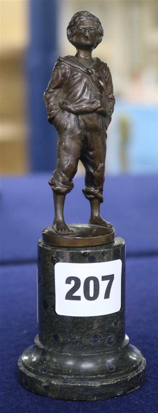 A bronze figure of a boy